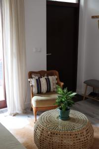 a living room with a chair and a table at Baltic Nature in Łukęcin