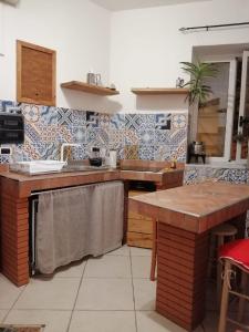 a kitchen with a sink and a counter top at ngopp a via nova in Agropoli
