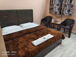 Voodi või voodid majutusasutuse Sudha sadan toas
