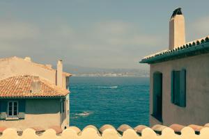 a view of the ocean from a building at Hotel la Ponche in Saint-Tropez