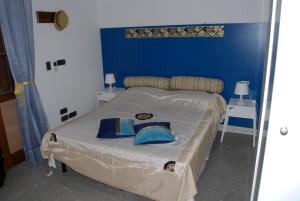 Postel nebo postele na pokoji v ubytování Perla B&b