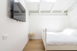 Łóżko lub łóżka w pokoju w obiekcie White Navigli