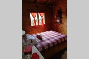 Postel nebo postele na pokoji v ubytování Intry Etna Chalet