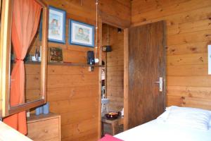 Postel nebo postele na pokoji v ubytování Intry Etna Chalet