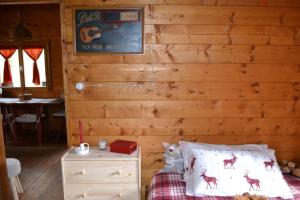Postel nebo postele na pokoji v ubytování Intry Etna Chalet