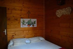 Een bed of bedden in een kamer bij Intry Etna Chalet
