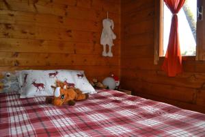 Postel nebo postele na pokoji v ubytování Intry Etna Chalet