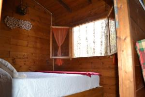 Postel nebo postele na pokoji v ubytování Intry Etna Chalet