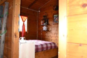 Postel nebo postele na pokoji v ubytování Intry Etna Chalet