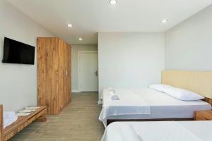 Katil atau katil-katil dalam bilik di La Cactus Butik Otel