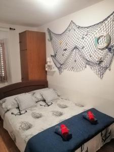 Ein Bett oder Betten in einem Zimmer der Unterkunft ANCHOR BAŠKA