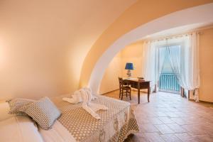 Posteľ alebo postele v izbe v ubytovaní CASA BELLAVISTA Scala Minuta Amalfi Coast