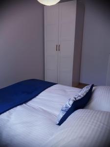 Posteľ alebo postele v izbe v ubytovaní Apartament KATE