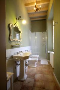 a bathroom with a sink and a toilet and a shower at Villa Valentina in Tradate