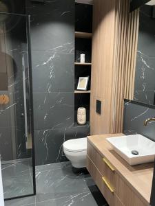 Koupelna v ubytování Nautica Resort - apartament Masurian Sailor + 19 fotografií