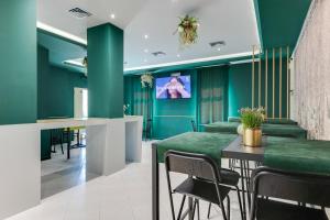 TV a/nebo společenská místnost v ubytování Hotel Sorriso