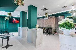 TV a/nebo společenská místnost v ubytování Hotel Sorriso