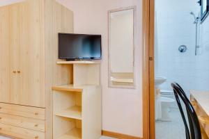 TV a/nebo společenská místnost v ubytování Hotel Sorriso