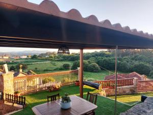 a view from the patio of a house with a large umbrella at A Casiña do Xastre in Pontevedra
