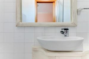Koupelna v ubytování Hotel Sorriso