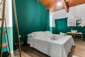 Postel nebo postele na pokoji v ubytování Hotel Sorriso