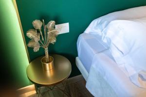 Postel nebo postele na pokoji v ubytování Hotel Sorriso
