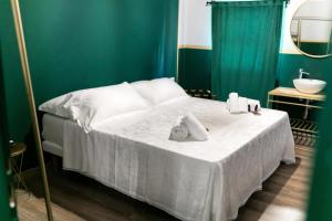 Postel nebo postele na pokoji v ubytování Hotel Sorriso