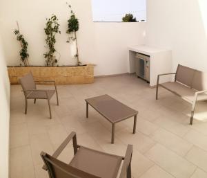 A seating area at Residence Valentina int 4 - Rooftop Sea View Infinity Pool