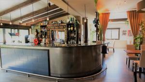 a bar in a restaurant with a counter at Casona Granado in El Pilar y Provincias