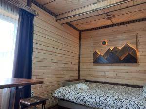 Кровать или кровати в номере Voyage Tatariv