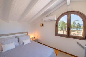 Postel nebo postele na pokoji v ubytování Venetian Shipyard Cottage