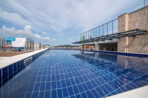 a swimming pool on the roof of a building at Cinema Hotel in Primorsko