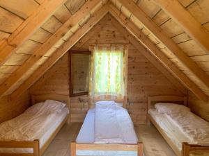Postel nebo postele na pokoji v ubytování Guest House Ulaj