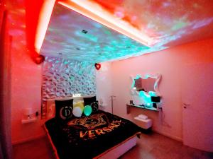 a bedroom with a bed with a fish ceiling at Diamond Suite Verona in Verona