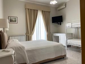Postel nebo postele na pokoji v ubytování Hotel Ristorante Colleverde