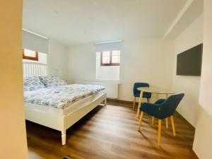 Voodi või voodid majutusasutuse Apartmány V uličce Frymburk toas