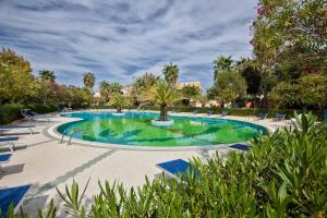 The swimming pool at or close to L'Oasi di Ottiolu