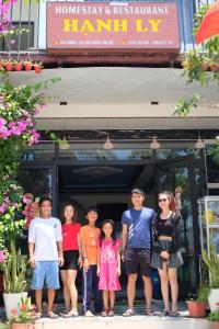 a group of people standing in front of a restaurant at Chamisland Hanhly homestay in Hoi An