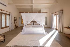 Ένα ή περισσότερα κρεβάτια σε δωμάτιο στο Villa dos Nativos Boutique Hotel