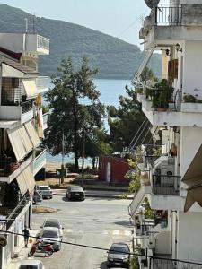 a view of a parking lot between two buildings at ALEKA KOTSI ROOMS in Igoumenitsa