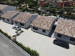 an aerial view of two houses with roofs at Le Domaine De Marie in Palasca
