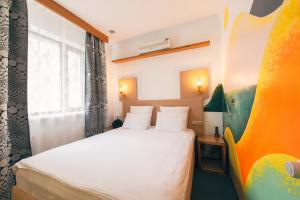 Posteľ alebo postele v izbe v ubytovaní Inn OZZ Astana