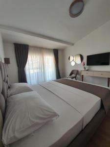 En eller flere senge i et værelse på Apartments Boreta