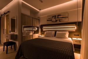 a bedroom with a large bed in a room at Lighthouse Apartments in Stoupa