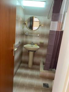 a bathroom with a sink and a mirror at Apartments Mare in Mlini +52 photos