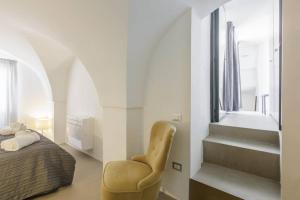 A bed or beds in a room at TORRE BIANCA VISTA MARE
