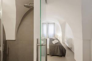 A bed or beds in a room at TORRE BIANCA VISTA MARE