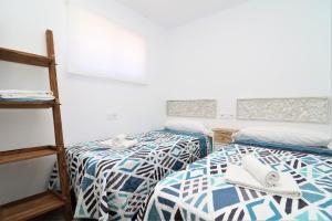 Ein Bett oder Betten in einem Zimmer der Unterkunft Penthouse El Pato 872 Levante Beach