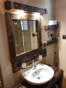 a bathroom with a sink and a mirror at Pamporovo Villa in Pamporovo +67 photos