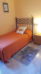 A bed or beds in a room at Piso romantico y espacioso